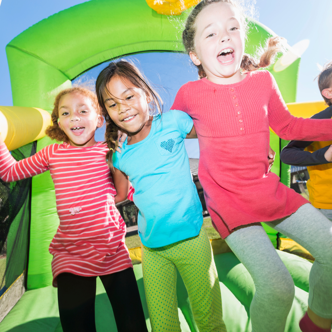 Kids having fun on a jumping castle